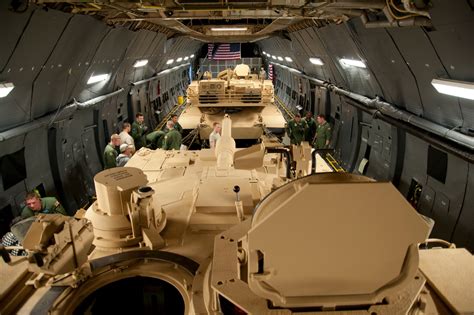 Lockheed C-5 Galaxy loading tanks during a military exercise