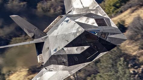 Lockheed F-117 Nighthawk stealth aircraft flying over Nevada desert test range