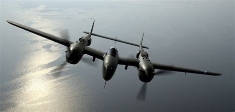 Lockheed P-38 Lightning twin-boom fighter over Pacific islands