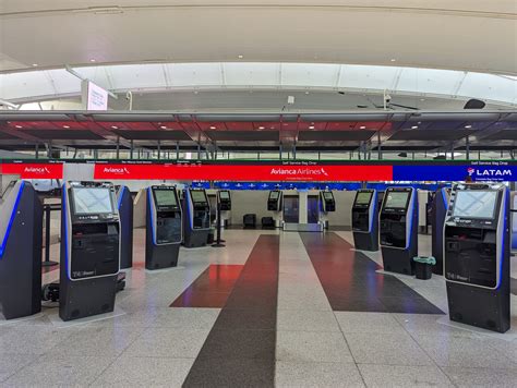 long lines at JFK check-in counters during peak summer delays