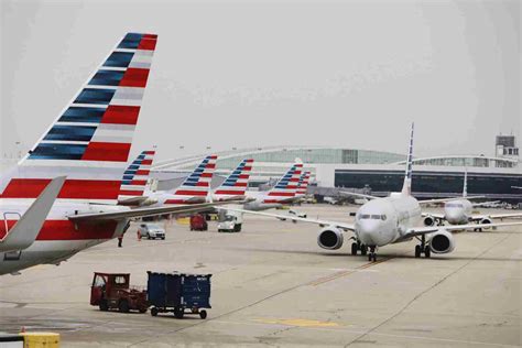 long passenger lines for flight rebooking at dallas and atlanta airports during summer storm disruptions