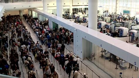 long TSA security lines airport shutdown delays crowded terminal passengers