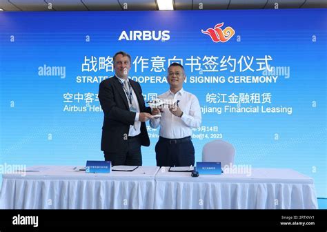Loong Airlines executives and Airbus representatives at signing ceremony for six A321neo aircraft