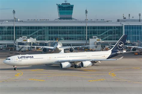 Lufthansa A340-600 undergoing maintenance at Frankfurt hangar during twilight