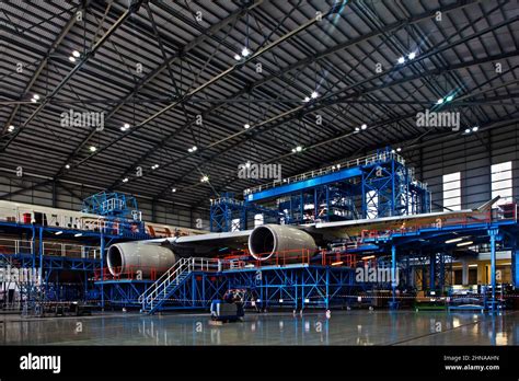 Lufthansa Technik aircraft engine maintenance facility with jumbo jet turbofan