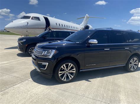 luxury black SUVs lined beside private jet at Van Nuys Airport FBO during Oscars arrivals