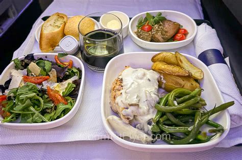 luxury united polaris meal with wine glass on transatlantic route