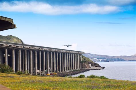 Madeira Airport runway extension supported by concrete pillars above Atlantic coastline