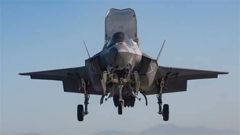 Marine F-35B maintenance crew conducting preflight checks on flight line