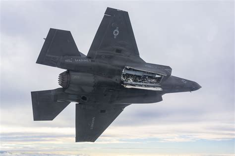 Marines performing F-35B maintenance at forward-deployed expeditionary base
