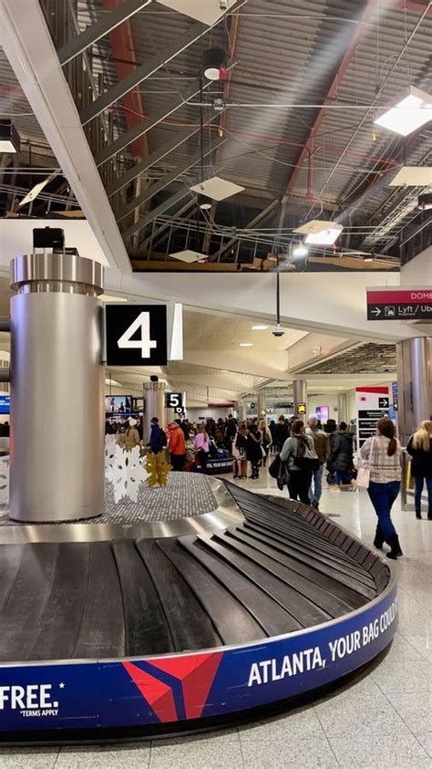 massive passenger lines at Atlanta Hartsfield-Jackson terminal during storm disruptions