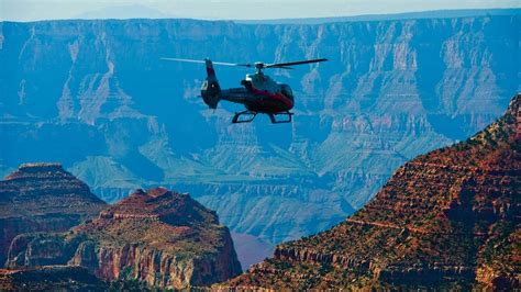 Maverick helicopter hovering above Dragon Corridor Grand Canyon