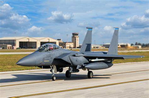 McDonnell Douglas F-15 Eagle air superiority fighter climbing under full afterburner