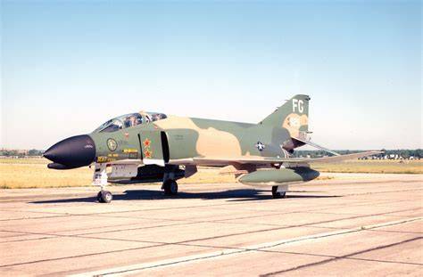 McDonnell Douglas F-4 Phantom II fighter-bomber over Vietnam with air-to-air missiles mounted