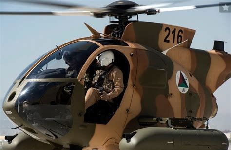 MD530F Cayuse Warrior in Afghan desert, armed with Hydra 70 and M3P .50 cal