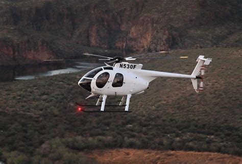 md530f helicopter in steep climb
