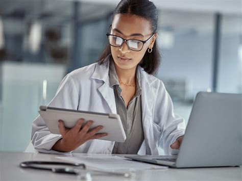 medical human factors specialist working on surgical robot interface design
