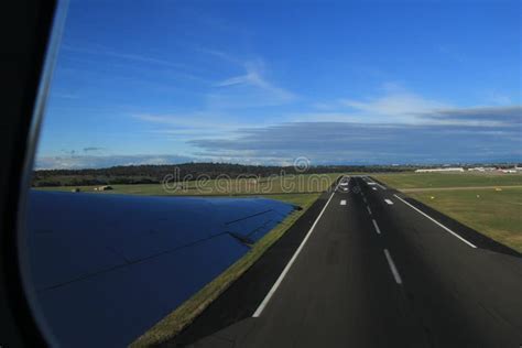 Melbourne Airport runway with aircraft taking off