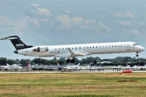 Mesa Airlines and Republic Airways jets at adjacent gates pre-merger announcement