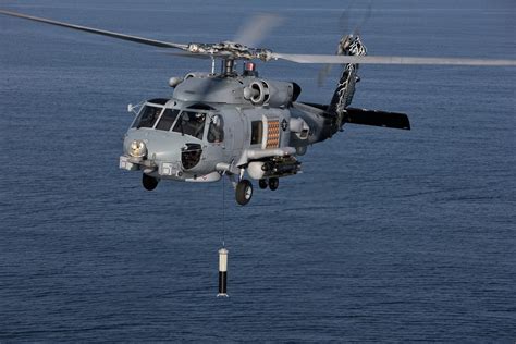 MH-60R Romeo with sonar gear lowered during anti-submarine exercise