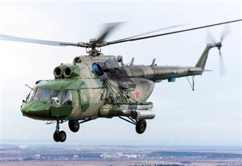 Mi-17 military helicopter flying low with cargo sling load