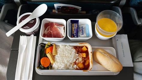 michelin-starred meal served on cathay pacific premium economy