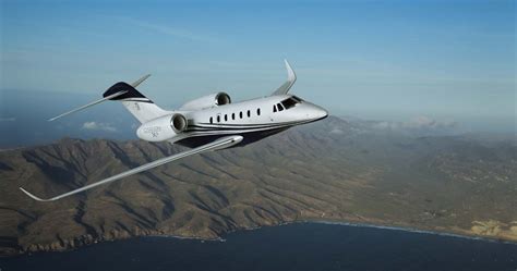 midsize business jet with fractional ownership branding in singapore hangar