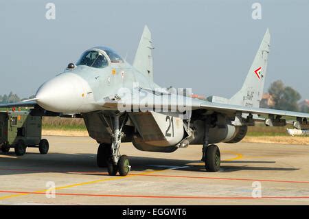 mig-29 fulcrum twin-engine fighter taxiing at civilian airstrip