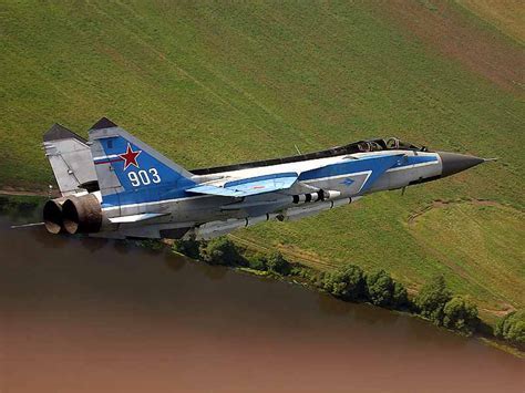 MiG-31 Foxhound flying at high altitude against blue sky