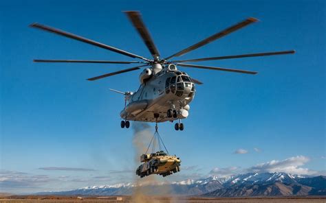 Mil Mi-26 lifting an entire truck in remote mountainous terrain