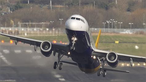 military cargo plane performing touch and go under heavy crosswind training