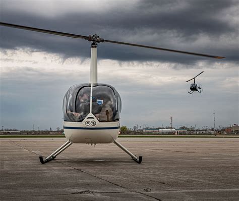 Milwaukee helicopter ride during twilight with lakefront lights and art museum below