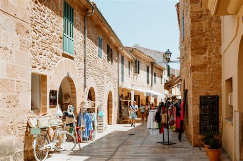 mindful tourists visiting local majorca market summer 2025