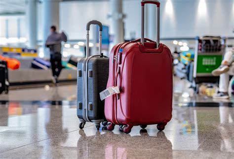 minimalist carry-on luggage on airport floor during busy season