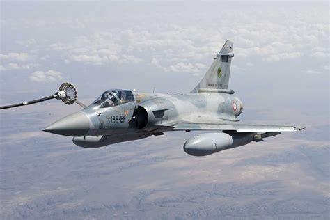 Mirage 2000-9 on a sunset training mission, showcasing its sleek delta wing profile and powerful afterburner glow