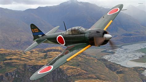 mitsubishi zero flying low above pacific island jungle
