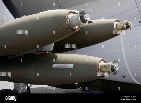 Mk 82 Snake Eye bomb loaded onto an F/A-18 on an aircraft carrier