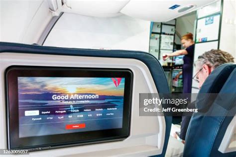 modern airline seatback entertainment system with large OLED display