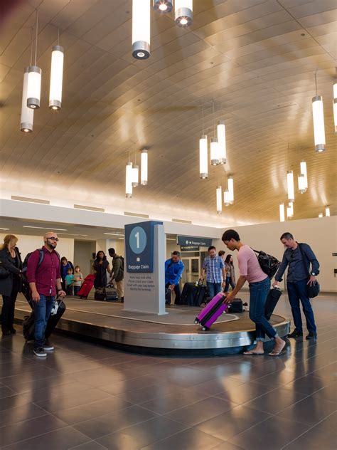 modern interior of San Bernardino International Airport terminal with passengers
