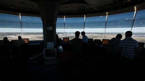 Montreal-Trudeau Airport control tower under evening sky during return of diverted flight