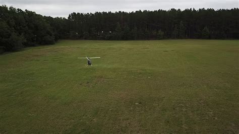 mosquito xe flying over open field during test flight