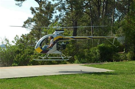 Mosquito XE helicopter parked on grass field