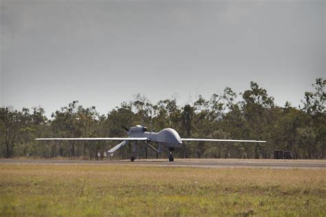 MQ-1C Gray Eagle armed and taxiing on military runway