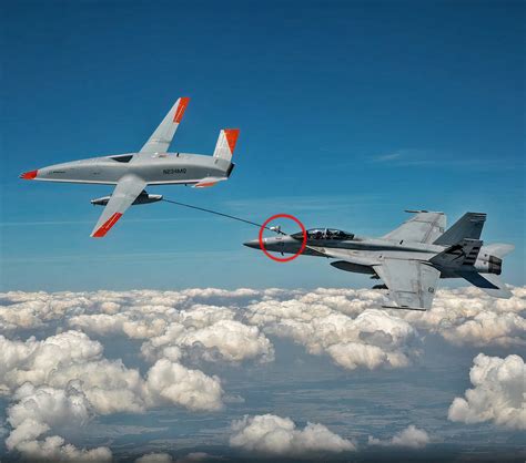 MQ-25 Stingray refueling an F/A-18 Super Hornet mid-flight