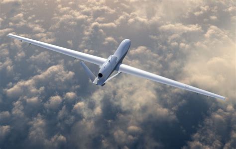 MQ-4C Triton high altitude drone flying above clouds over open ocean