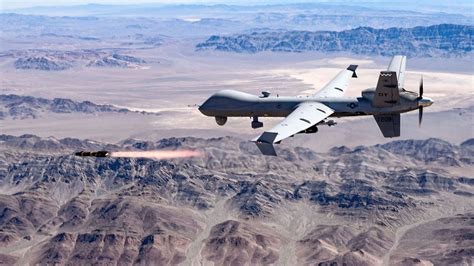 MQ-9 Reaper drone launching missile during desert surveillance mission
