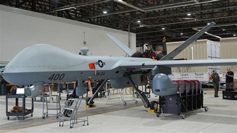MQ-9 Reaper drone providing surveillance during combat search and rescue mission