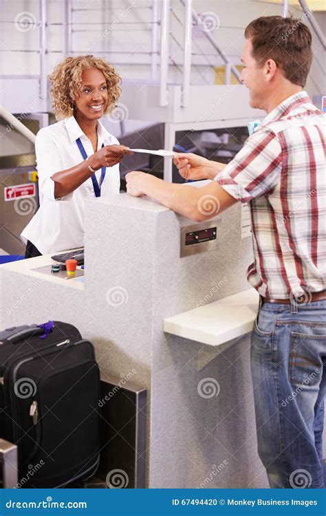multilingual airline staff at airport check-in desk California