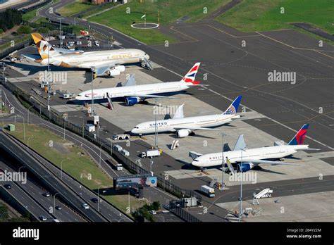 multiple Airbus A380 aircraft parked at international airport apron