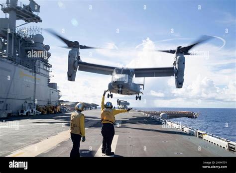 MV-22B Osprey tiltrotor aircraft launching from amphibious assault ship at sea